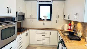 Highchair, cookware/dishes/utensils, freezer