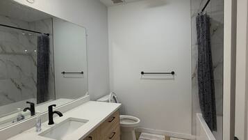 Hair dryer, towels, soap, toilet paper