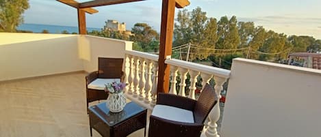 Luxury Room, Multiple Beds, Sea View | Terrace/patio