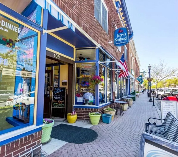 A brick building with a restaurant named 'Jerry's Seafood' on the ground floor.