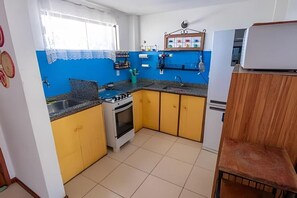 Family Apartment, Balcony, Sea View | Private kitchen - Seu Lar na Praia Grande (Arraial do Cabo)