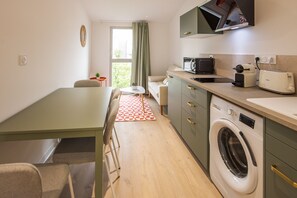 Apartamento premium, suíte, vista para a cidade | Cozinha privada