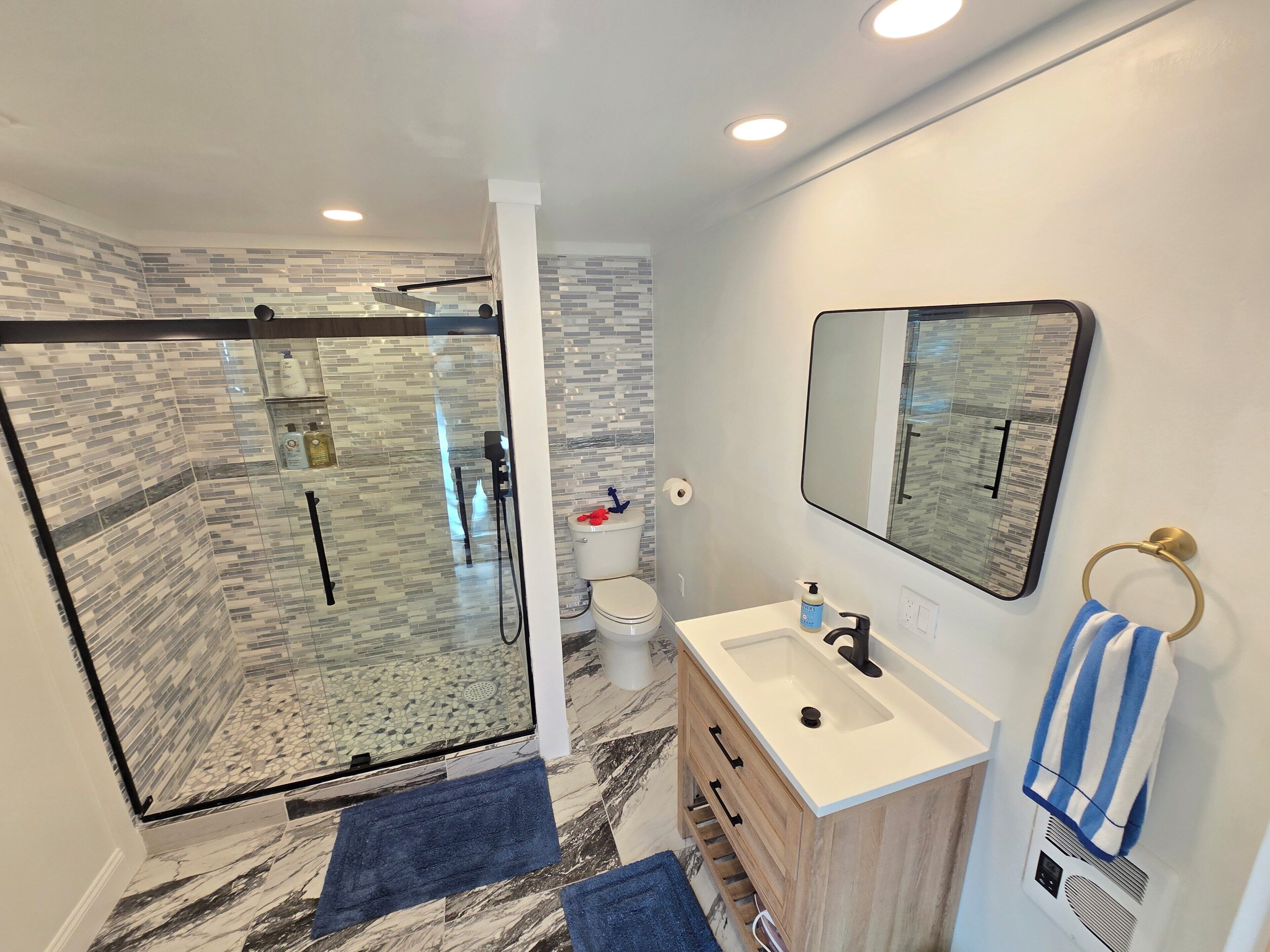 Shower, hair dryer, towels, soap