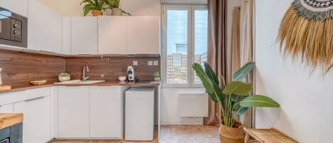 Fridge, microwave, coffee/tea maker, toaster