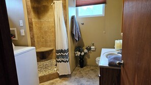 Shower, towels, soap, toilet paper