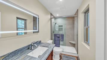 Shower, hair dryer, towels, soap