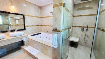 Luxury Suite, Balcony, Hill View | Bathroom | Separate tub and shower, hair dryer, slippers, towels
