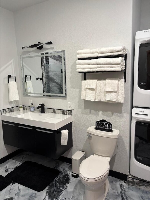 Shower, towels, soap, toilet paper