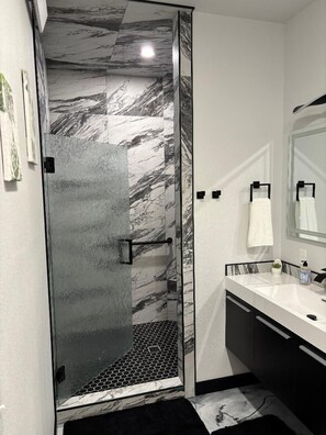 Shower, towels, soap, toilet paper