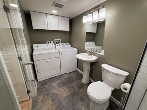 Shower, hair dryer, towels, soap