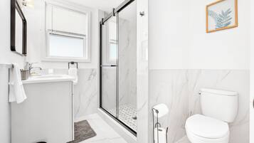 Shower, hair dryer, towels, soap