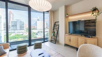Deluxe Suite, City View | Living area | 44-inch Smart TV with digital channels, streaming services