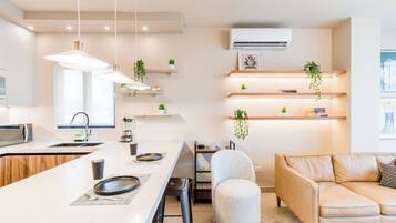 Deluxe Suite, City View | Living area | 44-inch Smart TV with digital channels, streaming services