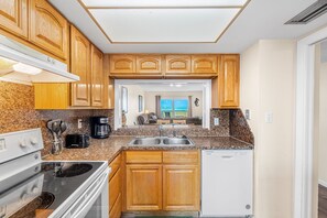 Fridge, microwave, oven, stovetop - Sunrise Oceanfront Condo 3BR | Balcony Breezes and Heated Pool 🌞🍹 (Cocoa Beach)