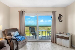 TV - Sunrise Oceanfront Condo 3BR | Balcony Breezes and Heated Pool 🌞🍹 (Cocoa Beach)
