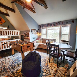 Smart TV, DVD player, foosball, books