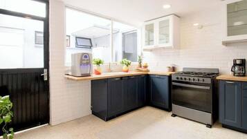 Fridge, stovetop, coffee/tea maker, cookware/dishes/utensils