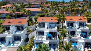 A resort with multiple buildings, each featuring a rooftop pool and surrounded by palm trees. - Cozy Condo/Ocean view/ Private balcony/Paseo la Jolla/ San Jose del Cabo (San José del Cabo)