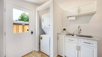 Shower, hair dryer, towels, shampoo
