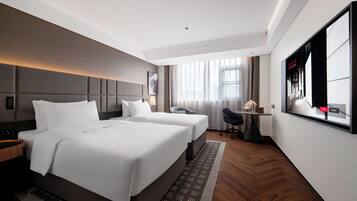 Premium bedding, down duvets, pillow-top beds, free minibar
