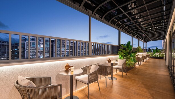 A rooftop terrace with seating, a city view, and a modern architectural ceiling. - IntercityHotel Guangzhou Huadu (Guangzhou)