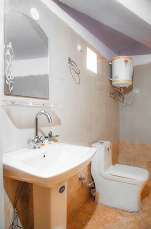 Double Room | Bathroom | Shower, slippers, soap, shampoo - Hotel Shri Krishna Residency Mathura (Mathura)