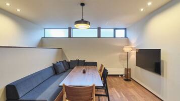 Comfort Condo | Living area | 50-inch flat-screen TV with digital channels