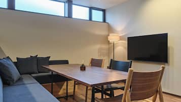 Comfort Condo | Living area | 50-inch flat-screen TV with digital channels