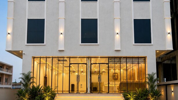 A building with the sign 'SHRI JIVILAS' at the top, featuring a modern facade with large windows and a glass entrance. - Shri ji vilas (Vrindavan)