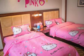 A hotel room with two beds, each with pink bedding featuring Hello Kitty designs, a wooden headboard, and a mirror above the beds. - Tianbao Hotel (Fushun)