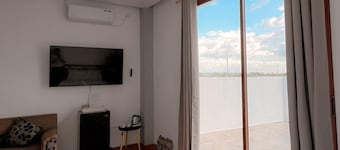 Near The Hundred Islands! Spacious-cozy tropical vibe airconditioned rooms.