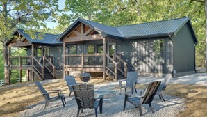 A cabin with a deck, outdoor seating, and a fire pit. - Walk to Kentucky Lake! Pet-Friendly Murray Duplex (Murray)