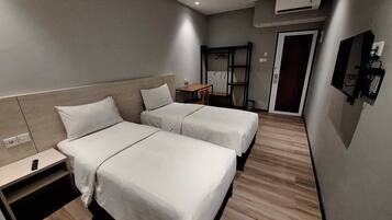 Chambre Deluxe avec lits jumeaux | Bureau, espace de travail pour ordinateur portable, Wi-Fi gratuit