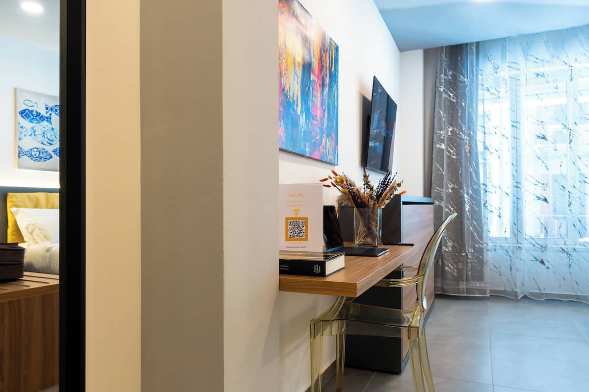 Triple Room, City View | In-room safe, laptop workspace, blackout drapes, free WiFi
