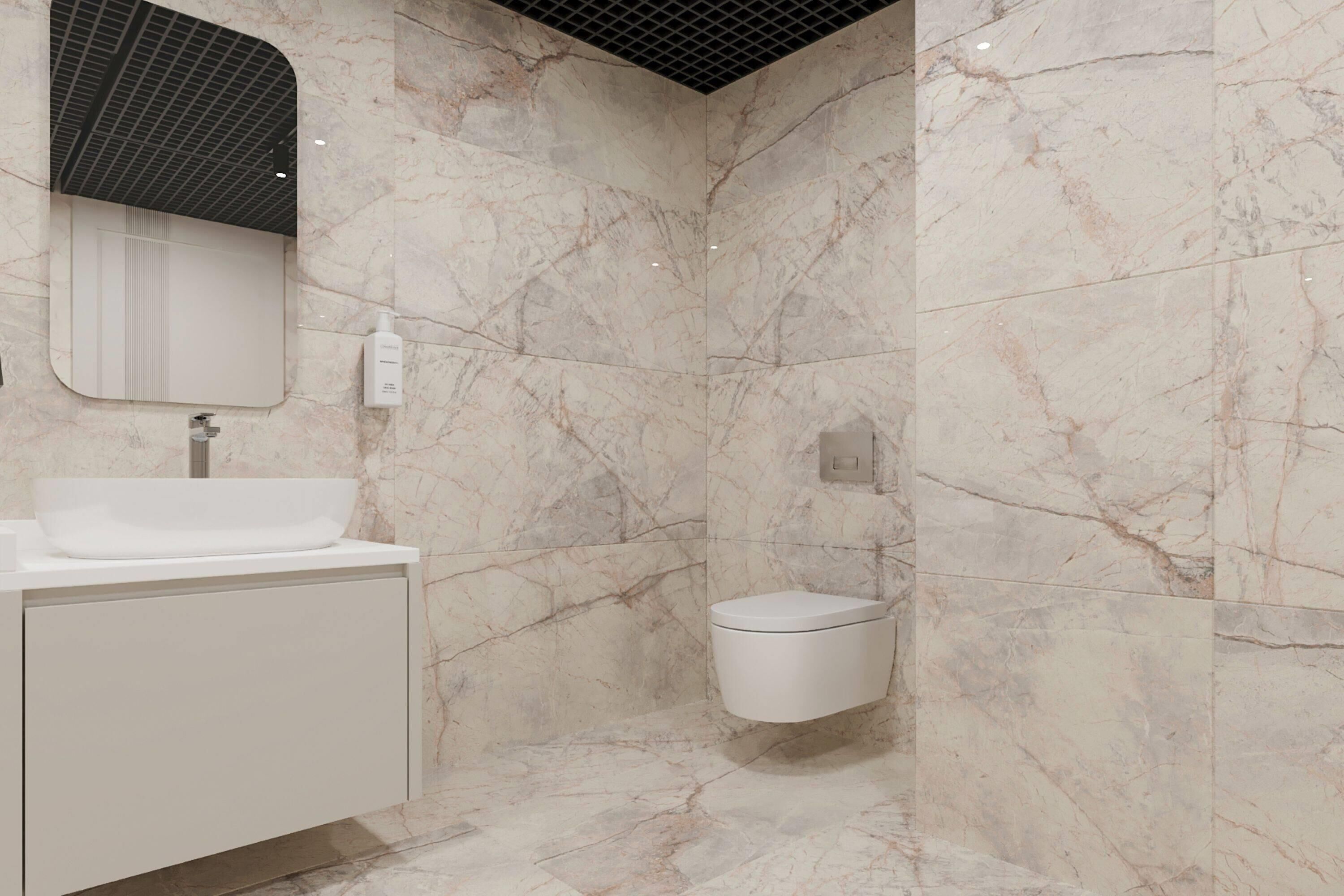 A bathroom with a marble wall, a sink, a toilet, and a mirror.