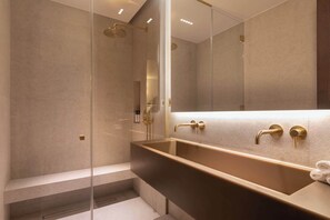 A modern bathroom with a large mirror, a walk-in shower, and a freestanding bathtub. - A Splendid 2-BR/2Ba w/ Services - Champs Elysées (Paris)