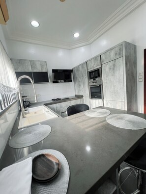 Deluxe Apartment, Balcony | Private kitchen | Full-size fridge, microwave, oven, stovetop