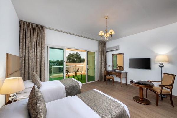 Twin Room, Balcony, Garden View | Desk, laptop workspace, WiFi (free), bed sheets