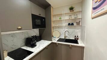 Fridge, microwave, stovetop, coffee/tea maker
