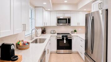 Coffee/tea maker, fridge, microwave, oven