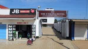 A building with a sign for 'JB BARBER & SPA' and 'THE ETHANS HOTEL ACCOMODATION RESTAURANT.' - Ehtans Hotel And Accommodations (Eldoret)