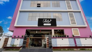A multi-story building with a sign reading 'Collection Company Serviced'. - Deluxe Mini Bypass Nellore Road (Nellore)