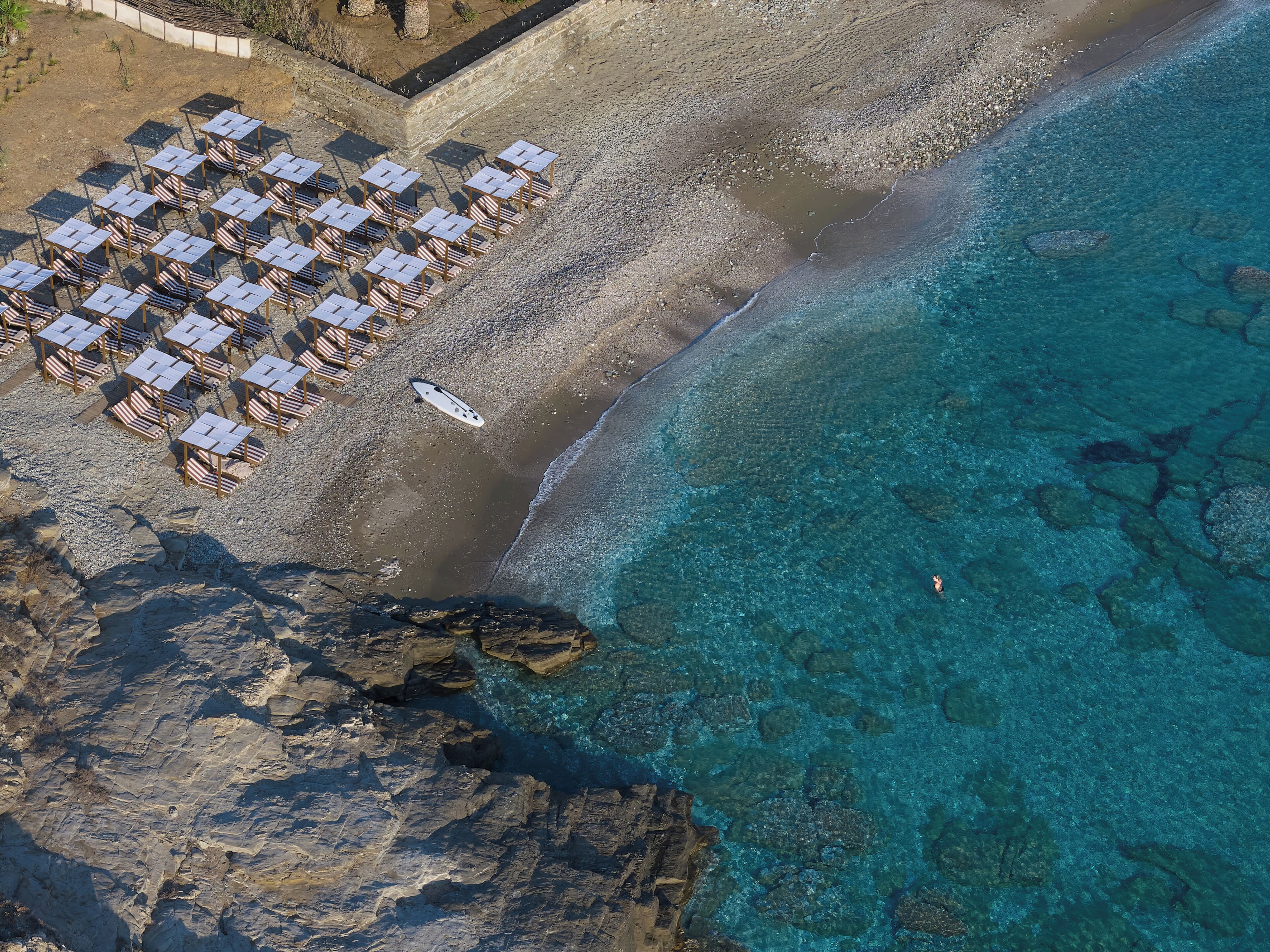 On the beach, white sand, free beach cabanas, sun loungers