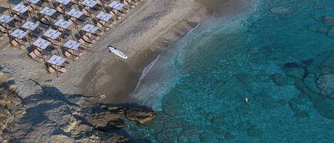 On the beach, white sand, free beach cabanas, sun-loungers