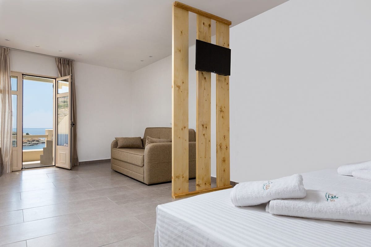 Superior Quadruple Room, Balcony, Partial Sea View | Free minibar items, in-room safe, soundproofing, iron/ironing board
