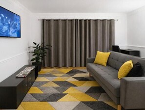 Studio Deluxe - utsikt mot trädgården | Vardagsrum