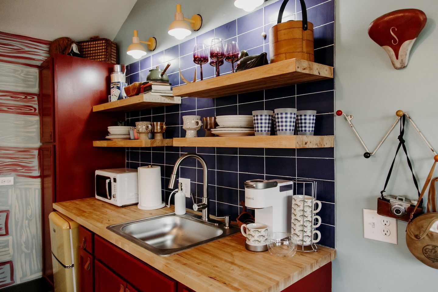 Fridge, microwave, coffee/tea maker, cookware/dishes/utensils