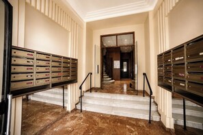 A hotel lobby with a marble floor, a staircase, and mailboxes on either side. - HOME FOR 2 FEW STEPS FROM CASINO MONTE CARLO AND BEACH (Beausoleil)