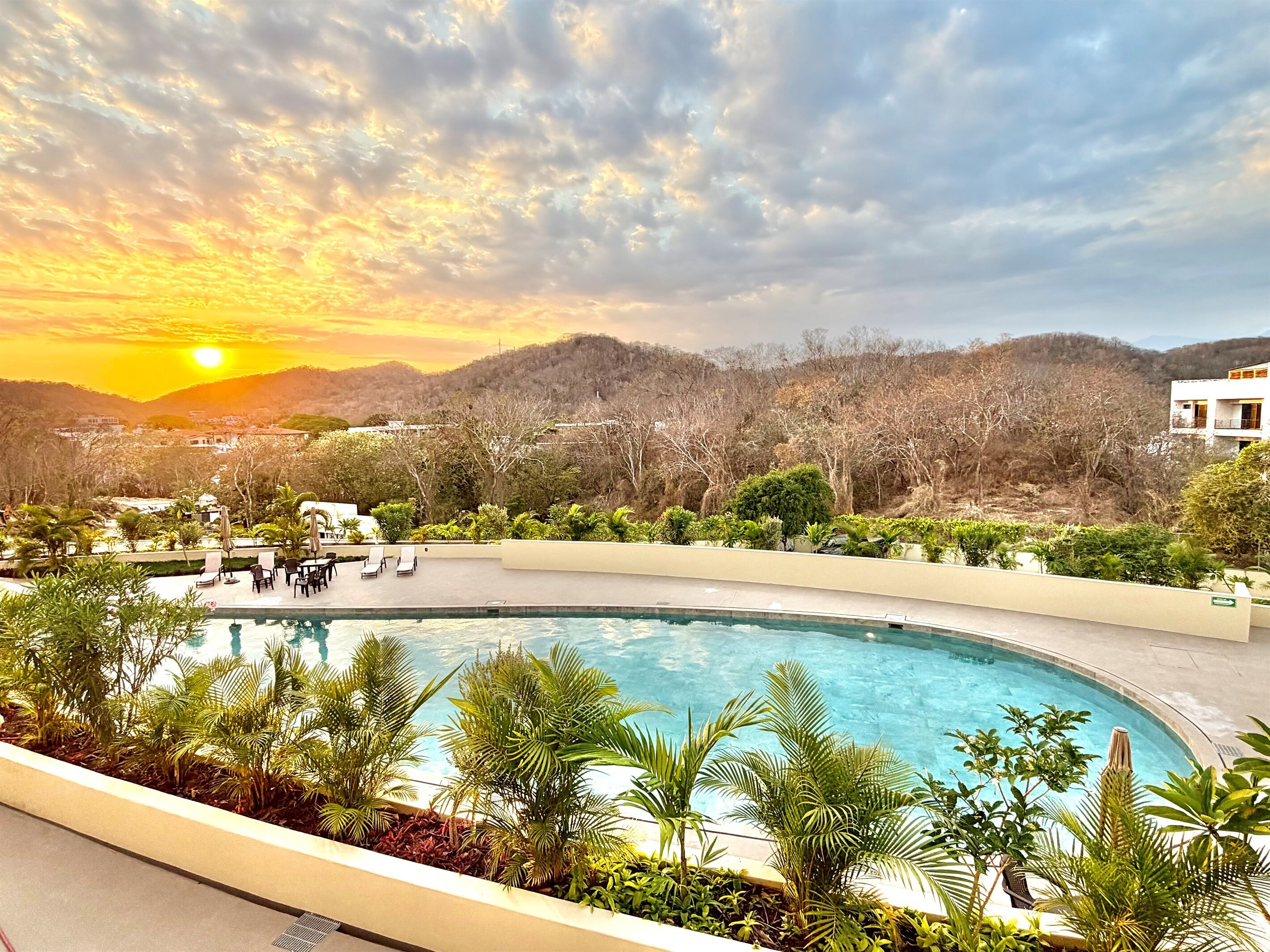 View of the sunset over the Sierra Madre mountains overlooking one of the Las Casitas pools