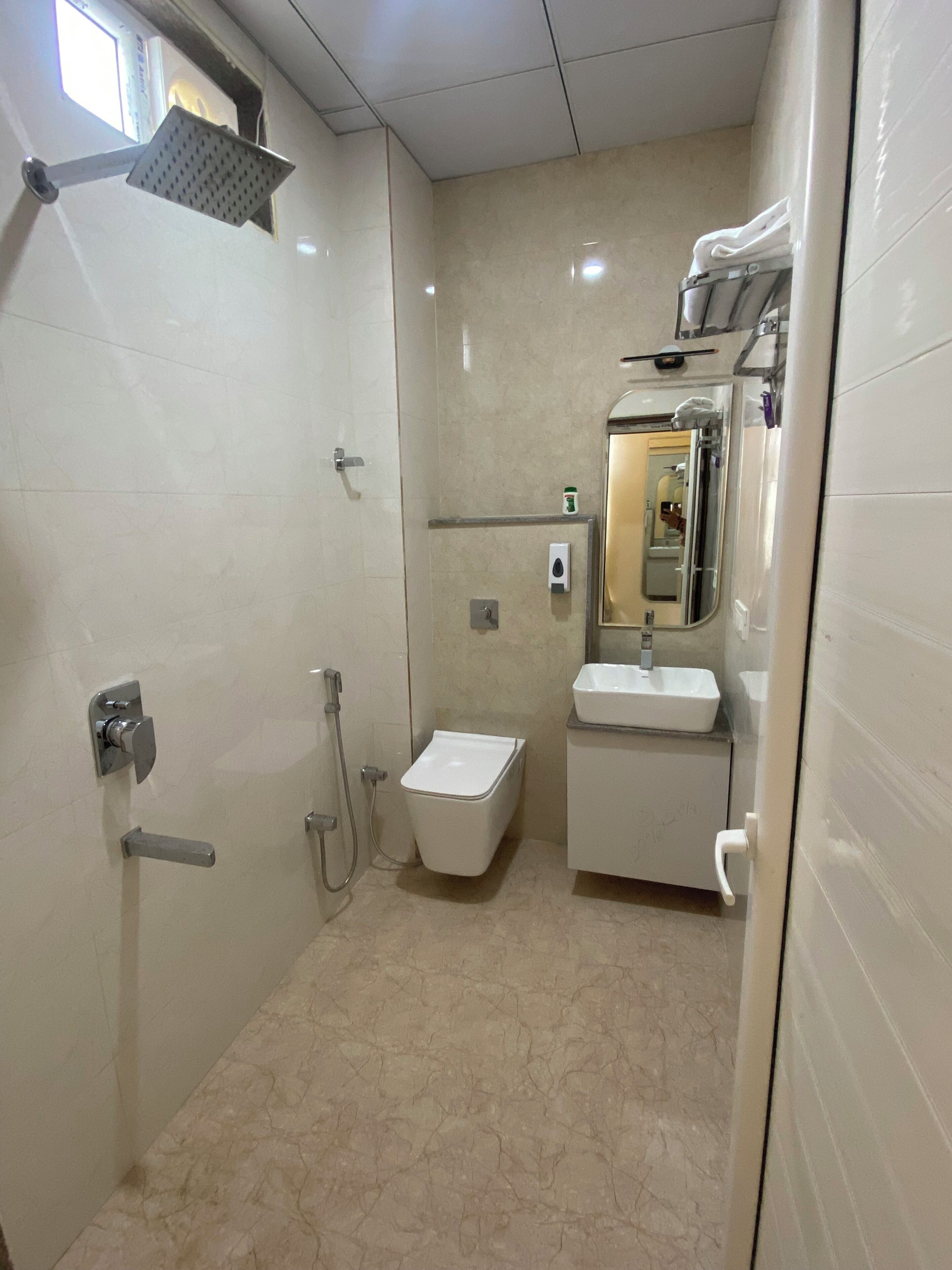 Shower, towels, soap, toilet paper